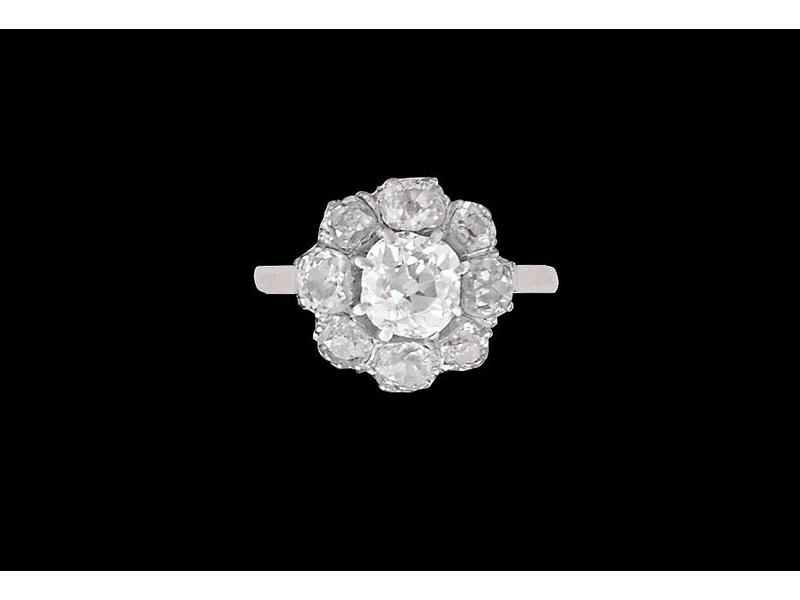 BAGUE marguerite en or gris (750) et platine...