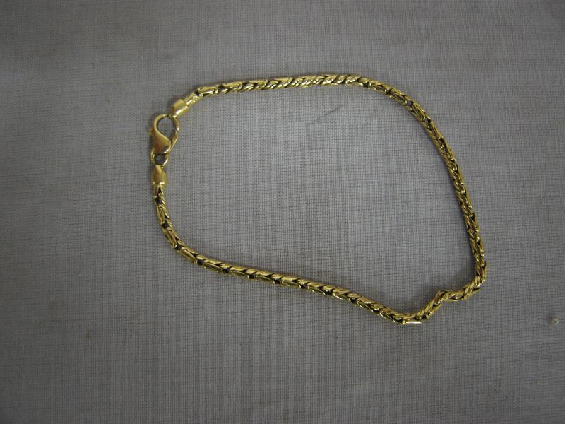 BRACELET gourmette en or jaune, à mailles...