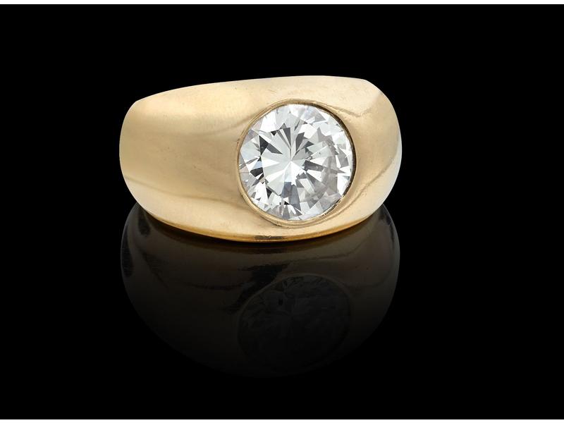BAGUE jonc en or jaune (18k) ornée d'un diamant...