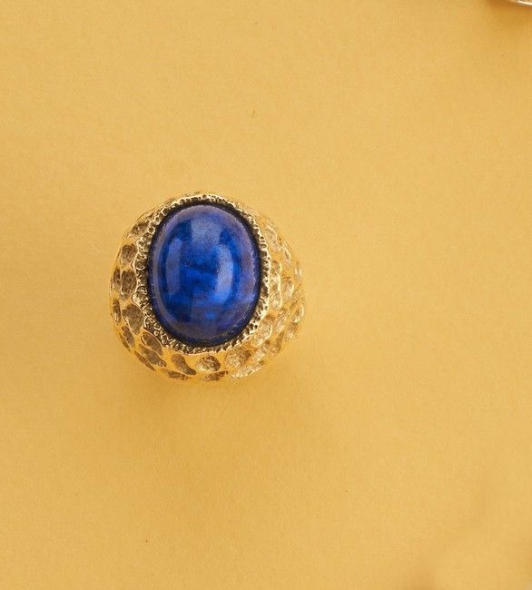 BAGUE design en or (750) centrée d'un cabochon...