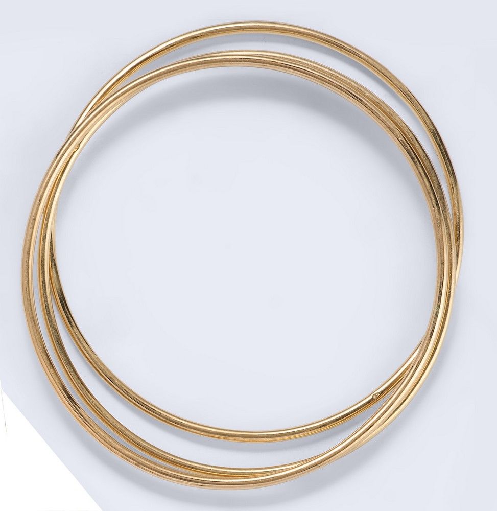 TROIS BRACELETS jonc en or jaune (750).