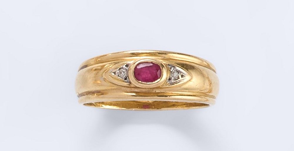 BAGUE jonc en or jaune (750) ornée d'un rubis...