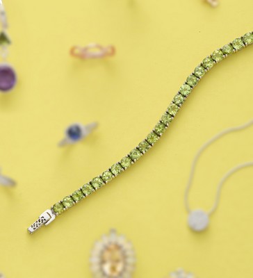 BRACELET LIGNE en argent (925) orné de péridots...