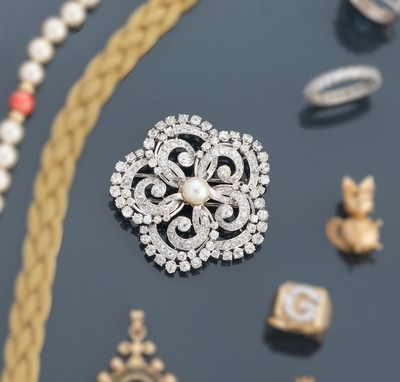 BROCHE rosace en or gris (750), centrée d'une...