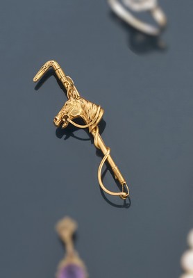 BROCHE en métal doré représentant une tête...