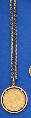 PENDENTIF en or (750) enserrant une pièce...